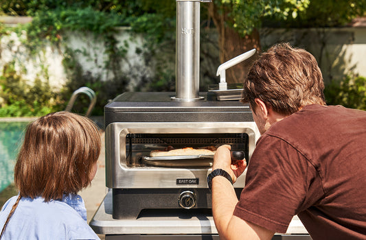 https://www.eastoak.com/cdn/shop/files/EAST_OAK_12_Outdoor_Pizza_Oven_with_Easy_Pellet_Loader_Wood_Fired_BBQ_Countertop_Pizza_Maker_with_360_Rotating_Stone_for_Outside_Kitchen_Cooking_Camping_Selling_Point_-_2.jpg?v=1703429988&width=533